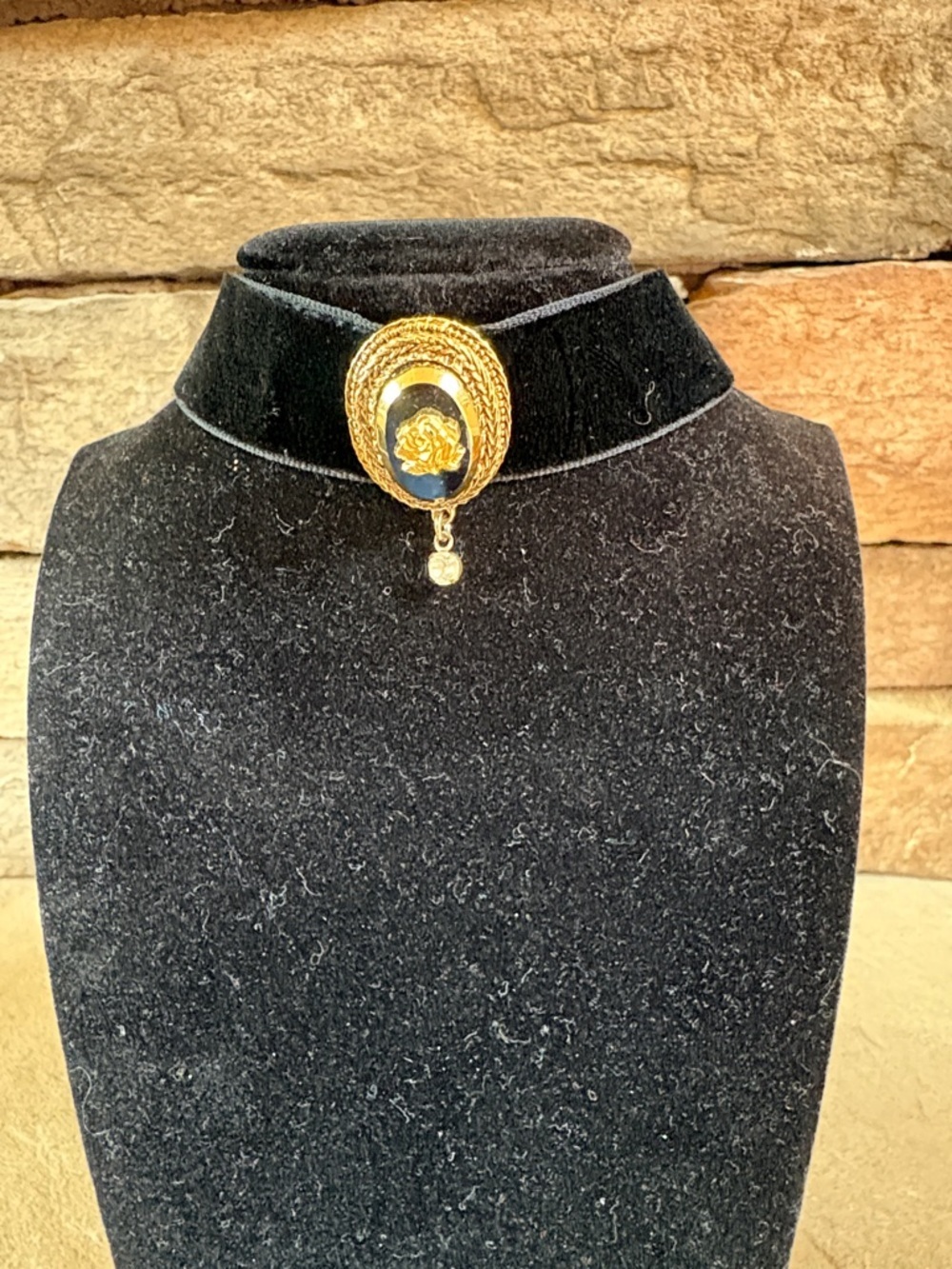 Celebrity black velvet choker with gold tone rose accent
